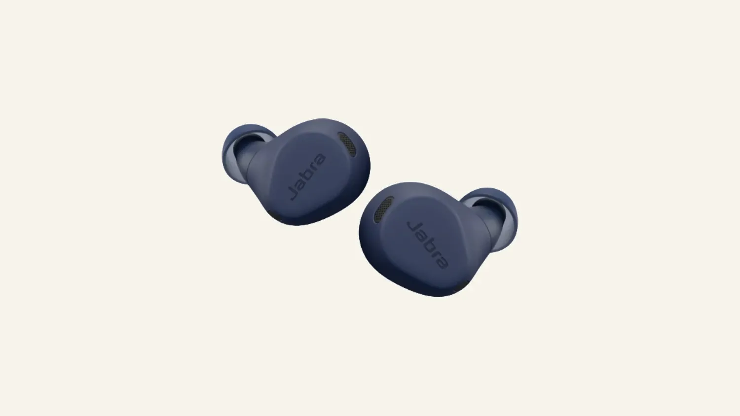 A pair of navy blue Jabra wireless earbuds floating on a warm cream background, angled apart.